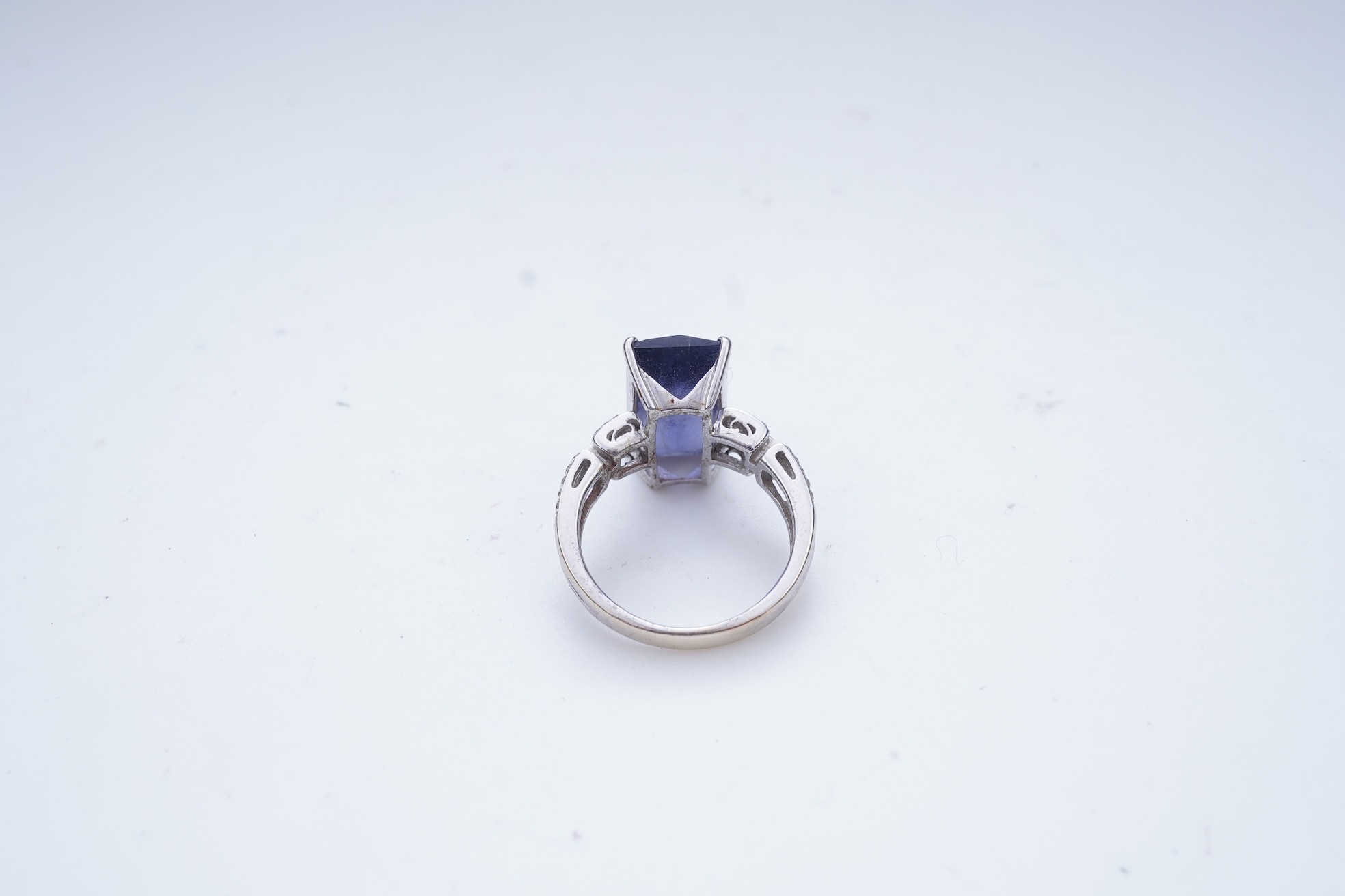 An iolite and diamond ring